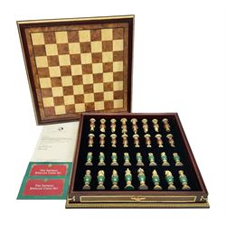 Franklin Mint House of Faberge 'The Imperial Jewelled Chess Set', to include set of chess pieces with malachite finish and a set with carnelian finish and a hardwood chess board