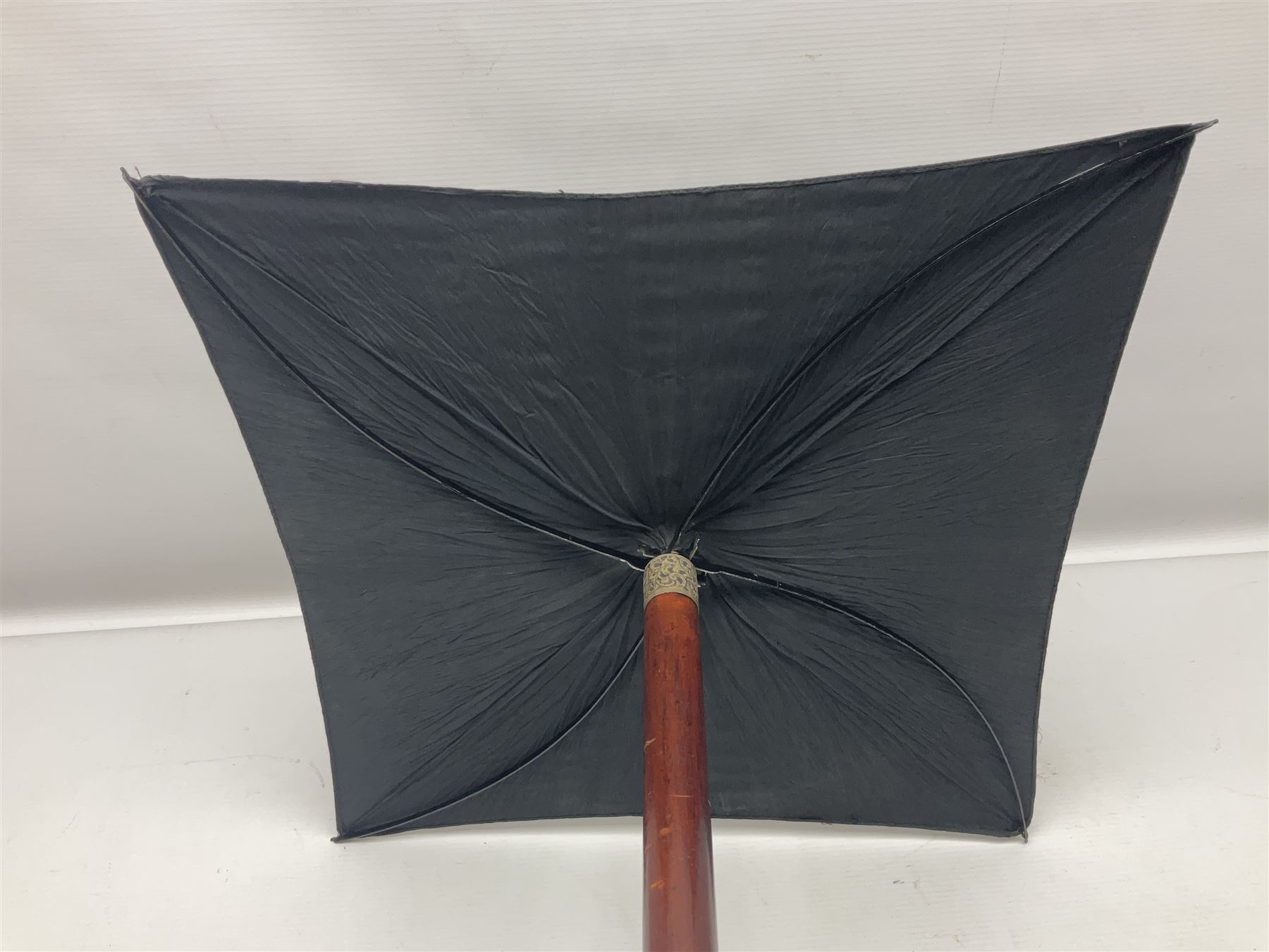 Victorian magician's cane, the mahogany walking stick twisting apart to reveal an internal mechanism, opening to tripod and black silk fold out magician's table, with horn handle and silver mount, hallmarked Birmingham 1891