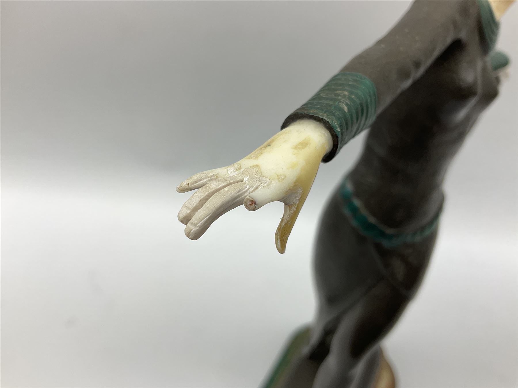 Art Deco style bronze, after Josef Lorenzl, modelled as a dancing lady with outstretched arms, with resin head and hands, raised upon marble effect base, signed to base, H38cm