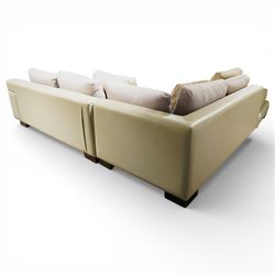Christian Liaigre (1943-2020) - 'Arpege' handmade L-shaped sectional sofa, upholstered in neutral leather, with broad squared arms, deep seat cushions, angled chaise section, loose back cushions, raised on block feet