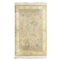 Chinese wool rug, the pale grey central field decorated with two stylised dragons, flaming...