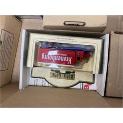 Collection of Tetley Tea collectibles to include sixteen 1:43 scale model cars from Lledo and Oxford Die-Cast with further Tetley Tea figures and tinned coaster set