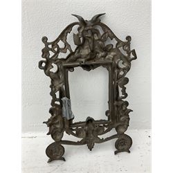 Ornate cast iron photo frame, decorated with floral swags and cherubs, with registered number stamped on back, H36cm