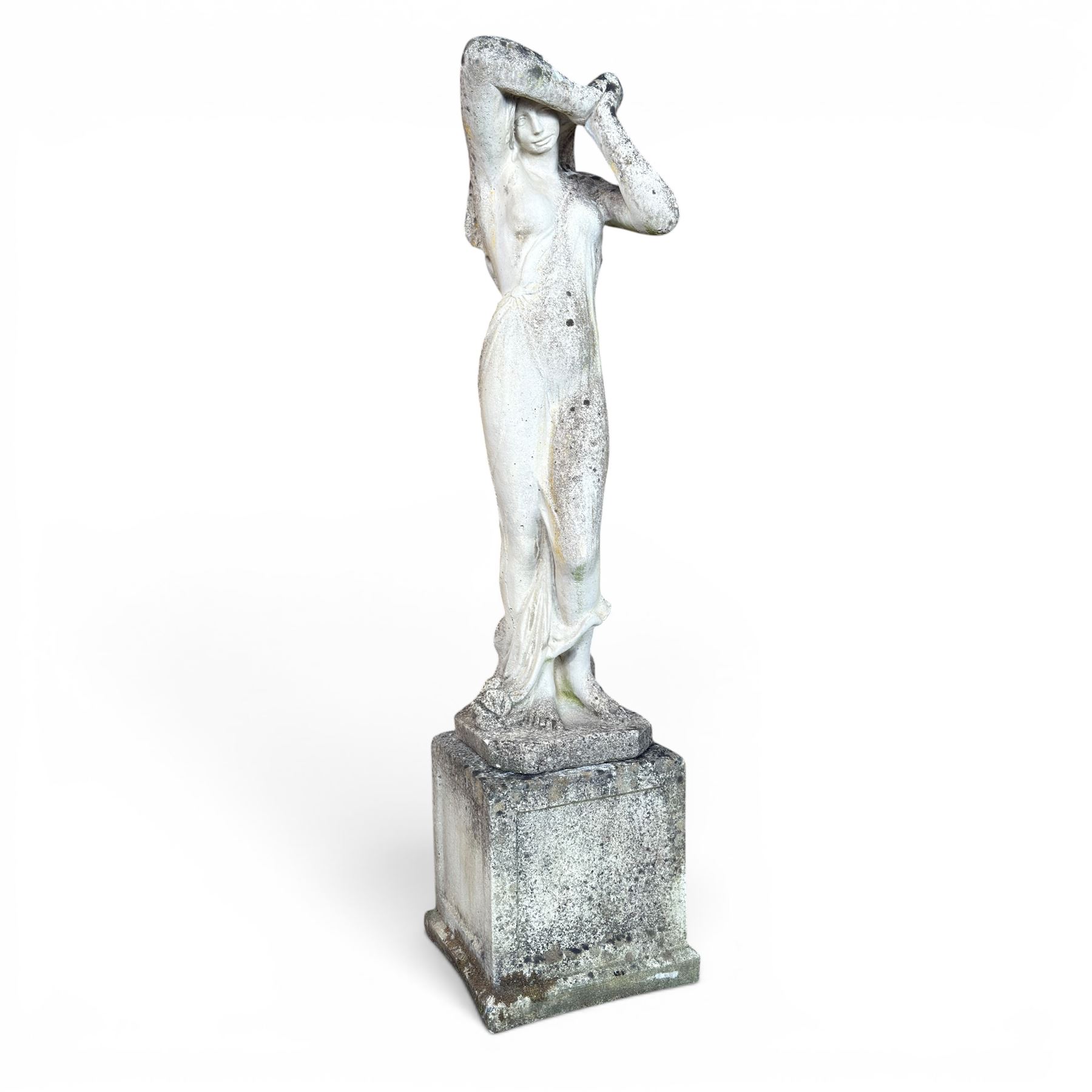 Weathered cast stone garden statue of a 'Shy Maiden', raised on square plinth base