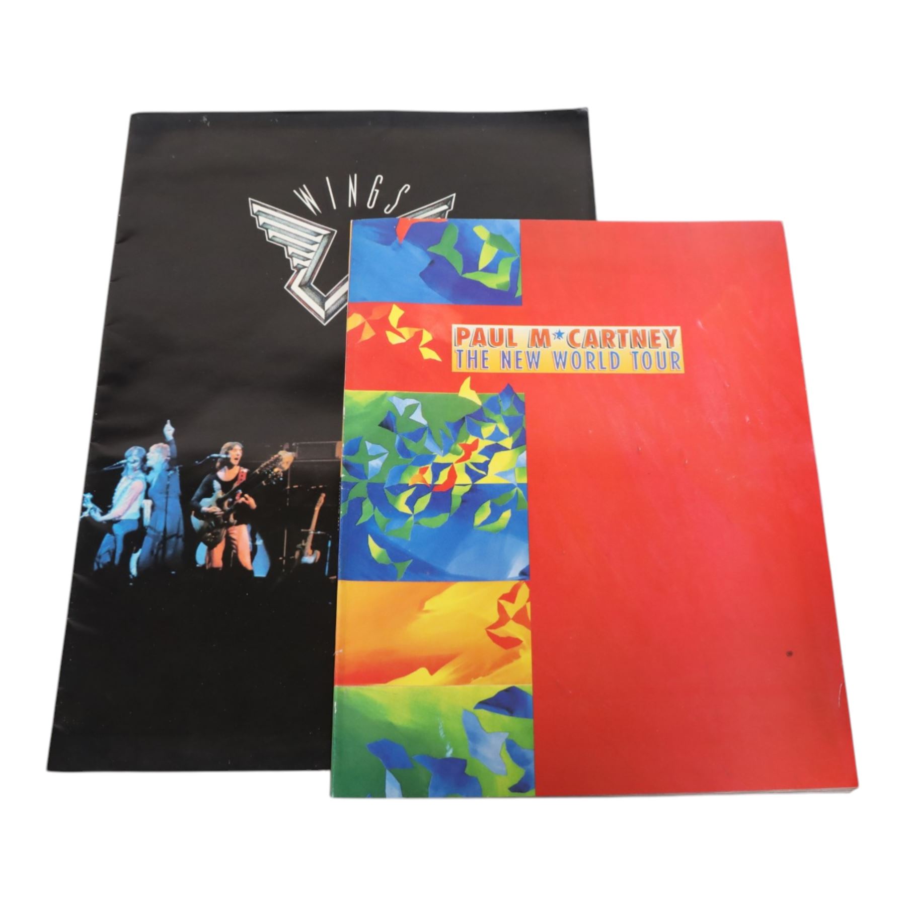 Music memorabilia, including cardboard globe, a free gift with the Wings Over America vinyl, music programmes, including Concert for George, Paul McCartney World Tour, Wings programmes, Glastonbury 1986, 10CC programmes, Knebworth Fair 1976 programme, etc