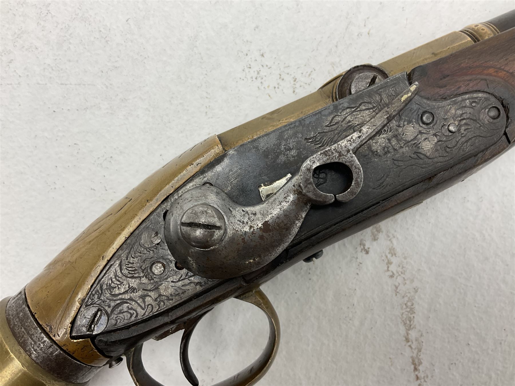 Late 18th century 7.2mm (approx. .28 calibre) Girandoni system single shot reservoir air rifle, the 62cm steel barrel with swivelling two-leaf rear sight, brass breech decorated with a sunburst and lever opening top loading, engraved steel lock-plates marked 'S. Gaskell' to the right side underneath the cocking lever, brass trigger guard,  leather covered steel butt reservoir of tapering conical form with brass ferrule and walnut fore-stock with horn mounts L107cm overall