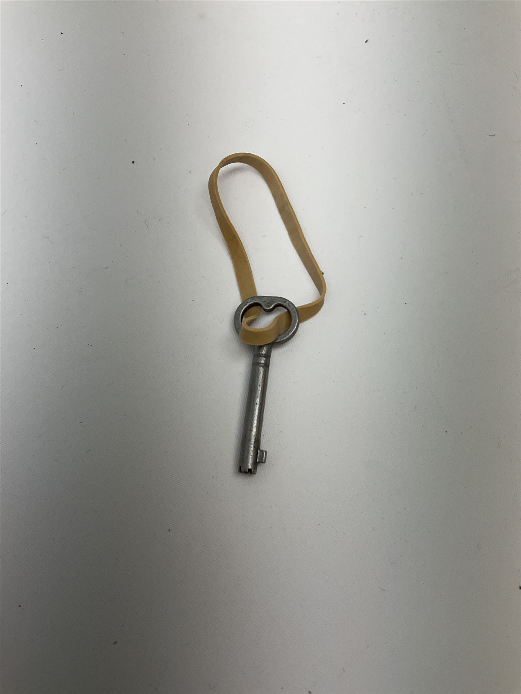 Early 20th century silver plated tantalus by John Grinsell & Sons of Birmingham, containing two crystal glass decanters, with key, H31cm