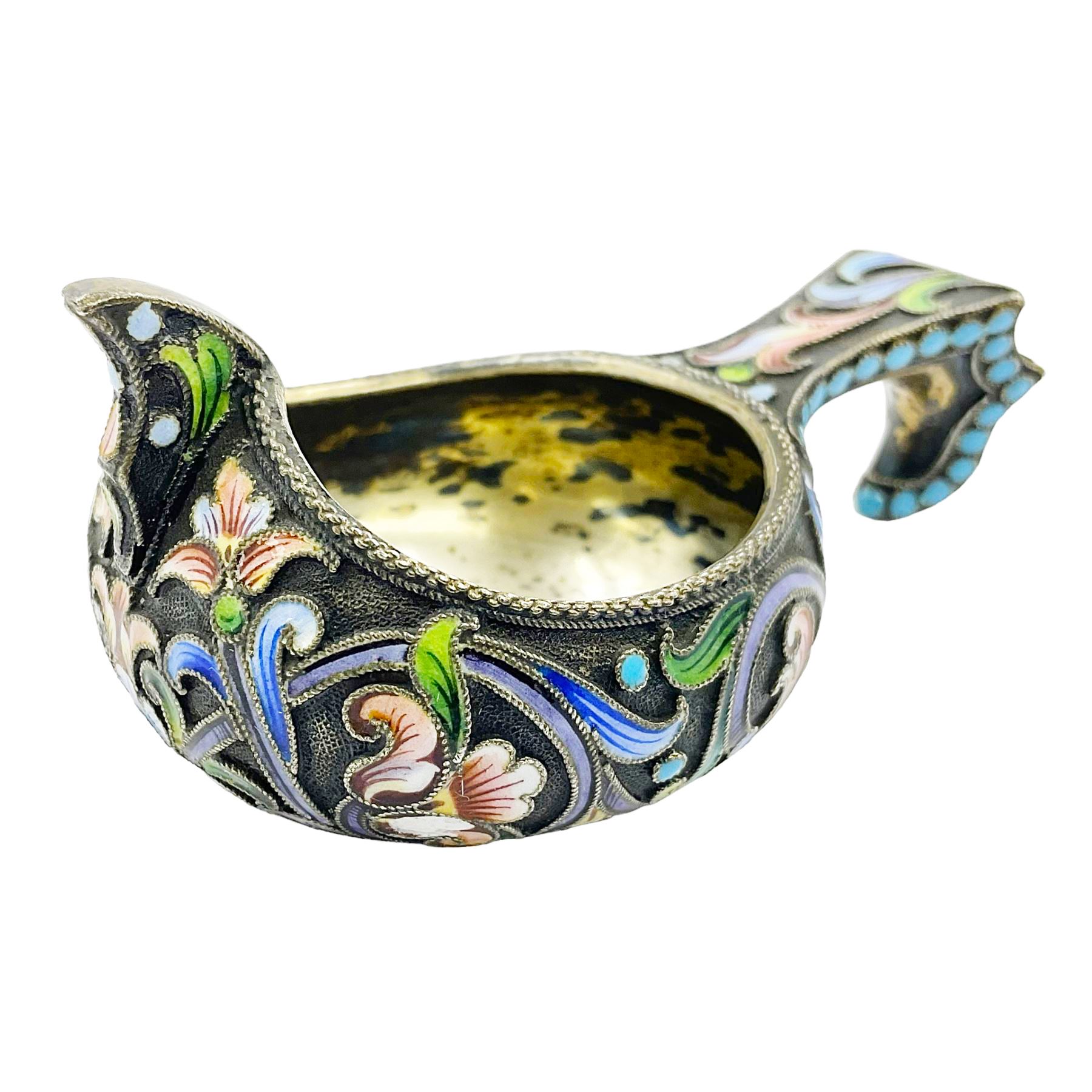 Late 19th century Russian silver kovsh, the body with polychrome cloisonne enamel floral decoration and turquoise enamel bead borders to base and handle, marked beneath with Kokoshnik mark, 84 standard, makers mark MC, possibly for Mikhail Fyodorovich Sokolov, L7cm, H3cm