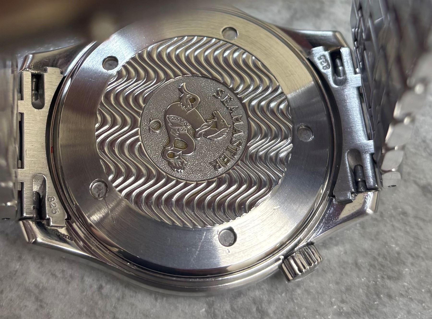 Omega Seamaster gentleman's stainless steel automatic chronometer wristwatch, Ref. 168.1623, Cal. 1120, blue wave dial, with luminous dot and baton hour markers with date aperture, unidirectional rotating blue bezel, on Omega stainless steel bracelet, with fold-over clasp, boxed