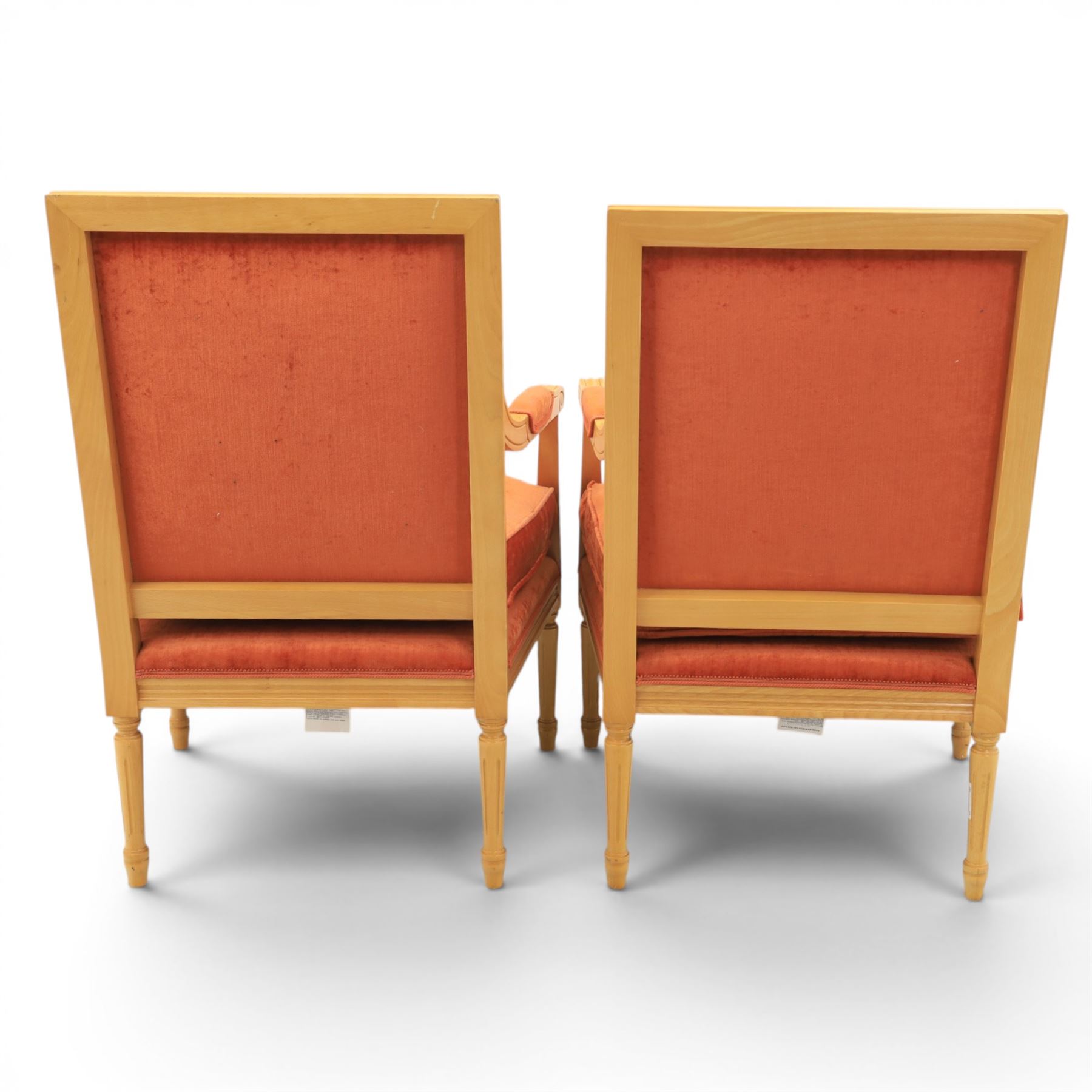 Pair of mid-20th century beechwood fauteuil armchairs, upholstered backrest and seat in terracotta velvet fabric, padded armrests with scroll detail, on tapered fluted supports with carved floral rosette blocks (very modern and not a desirable timber)