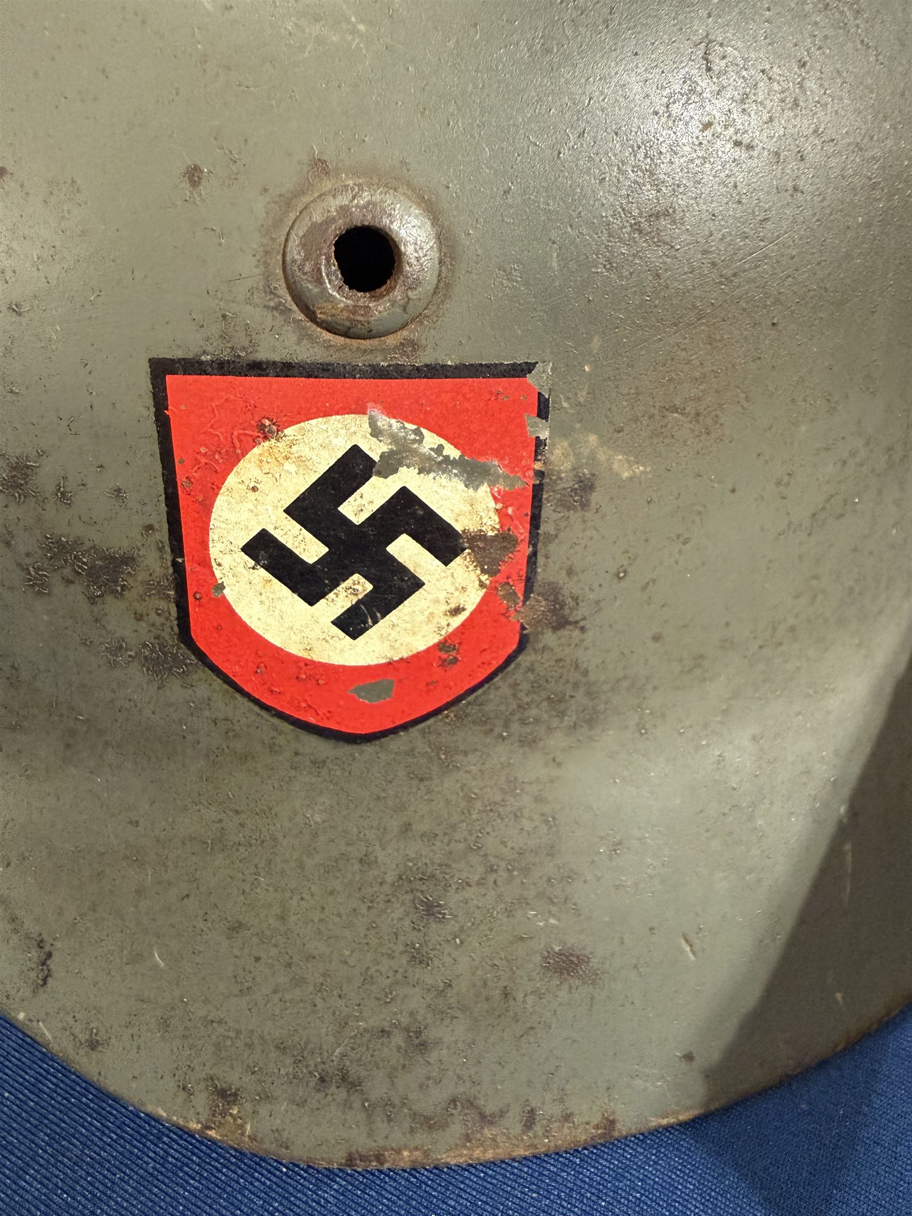 German Third Reich Waffen-SS M35 double decal helmet, the left inner brim stamped SF64, the back inner brim stamped 3866, with leather eight tongue liner and chinstrap