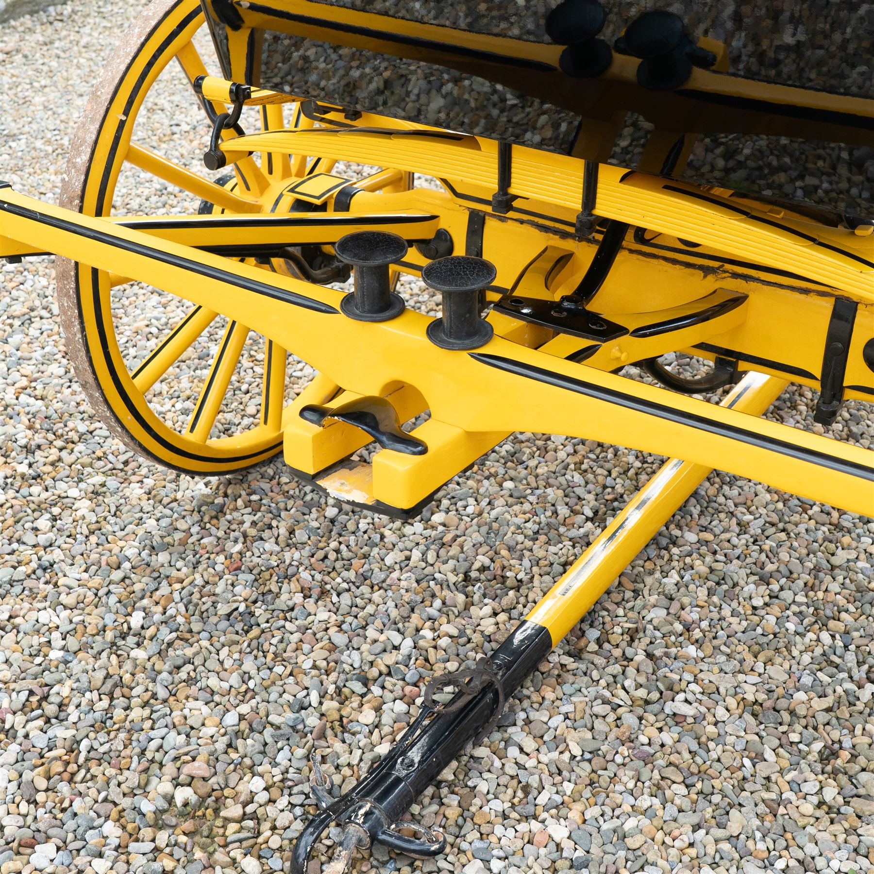 Roof Seat Break by Shanks of London

A roof seat break by Shanks of London built on a perch in black and yellow livery, the body fitted with an elevated driver's box seat, elevated rear groom's seat and central passenger compartment. The carriage is mounted on wooden spoked wheels with leaf spring suspension and is equipped with louvred underbody storage compartments, carriage lamp brackets (lamps next lot), folding access steps and a pole for driving with a pair or team of horses. The wheel hubs are stamped 