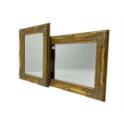 Pair bevelled edge wall mirrors in swept gilt frames decorated with ornate cartouches 