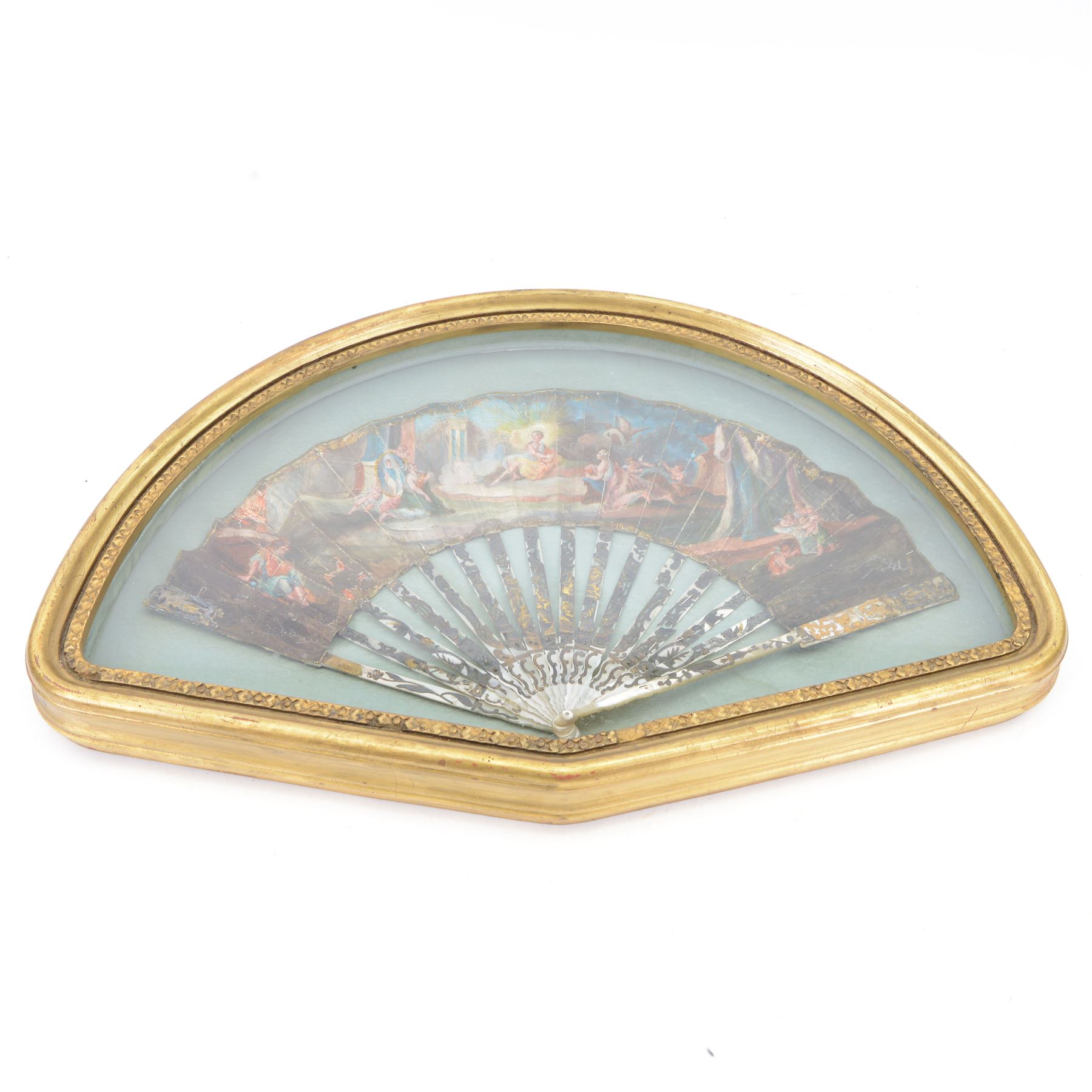 18th century fan, the mother-of-pearl sticks and guard carved, pierced, silvered and gilded, the paper leaf painted with mythological figures within gilt borders, framed and glazed, overall H35cm L55cm

Provenance: From the Estate of the late Dowager Lady St Oswald