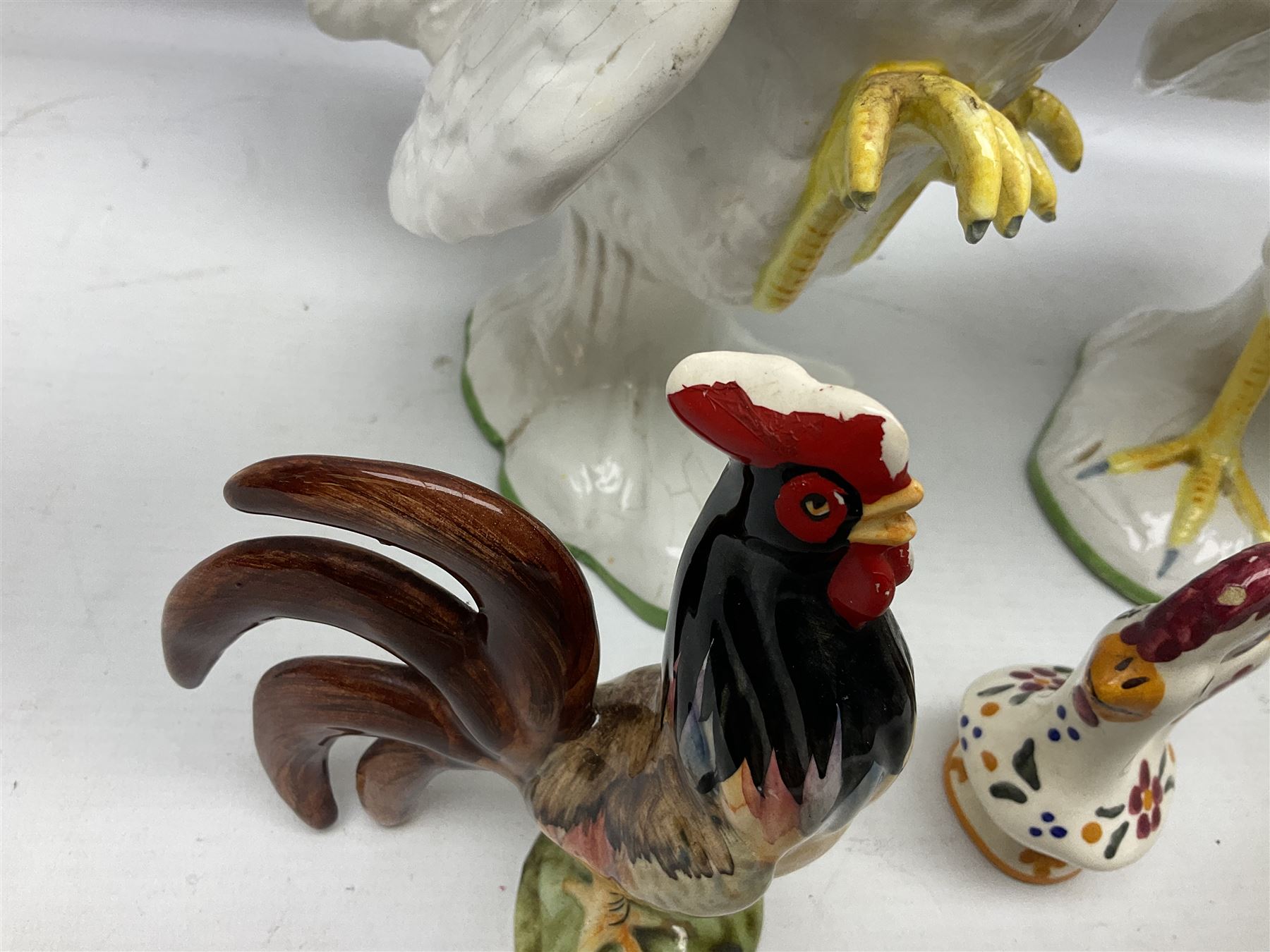 Pair of fighting cockerels from Italy together with three other ceramic cockerels, largest H30cm 