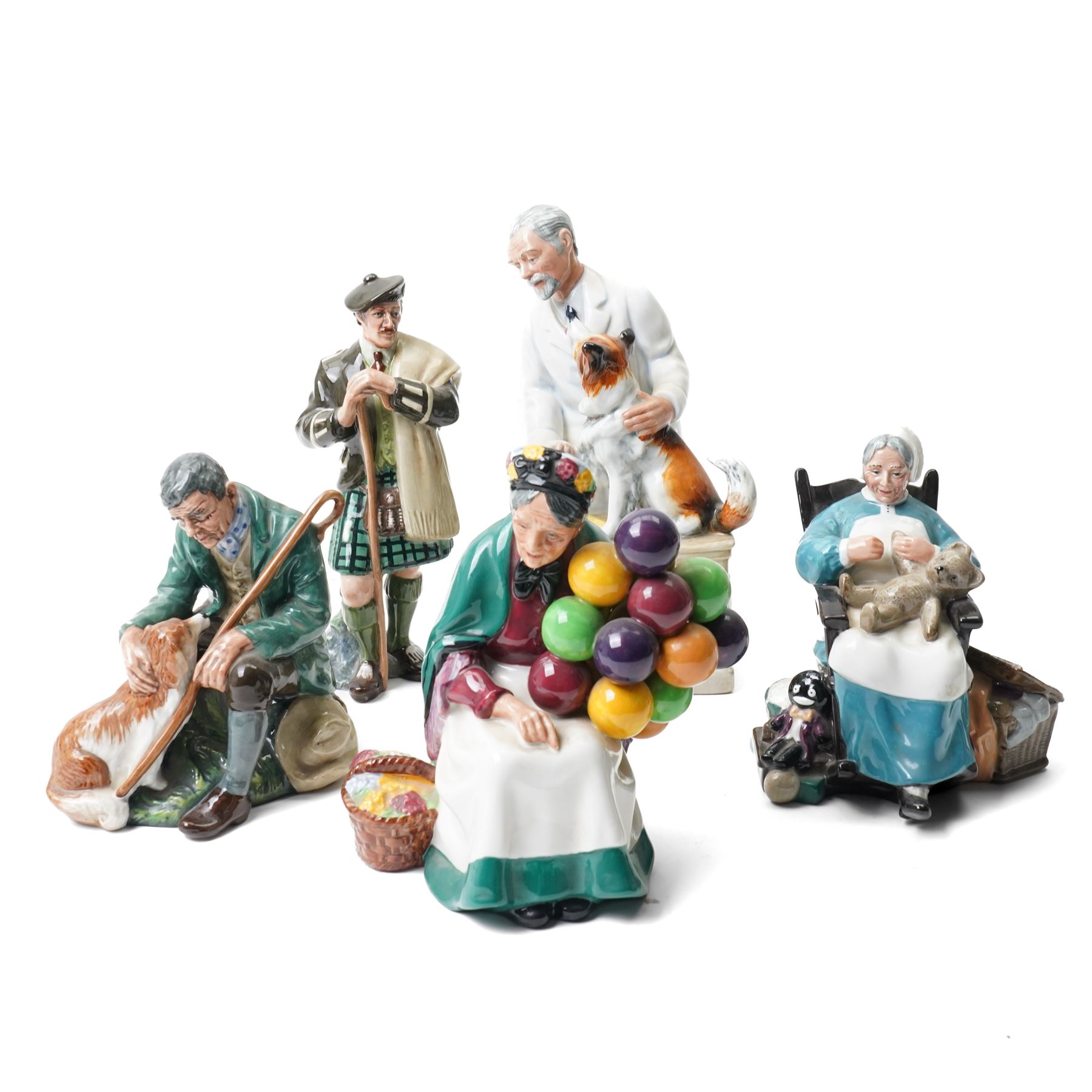 Five Royal Doulton figures comprising The Master HN2325 , Thanks Doc HN2731, signed,  Nanny HN2221, The Laird HN2361 and The Old Balloon Seller HN1315 