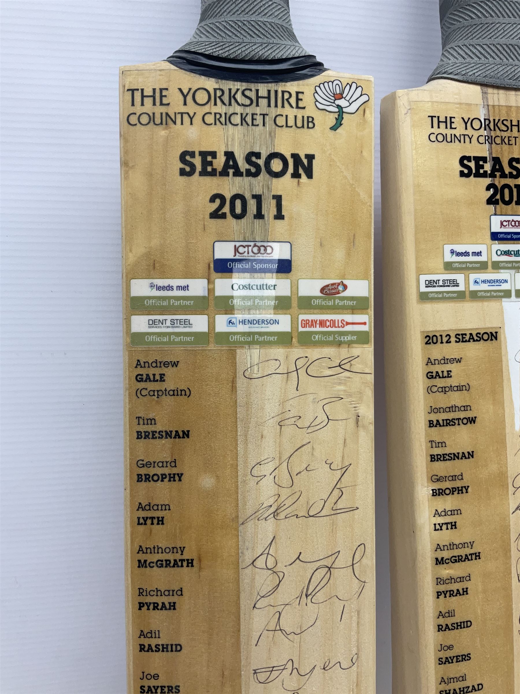 Two signed Yorkshire County cricket bats, from 2011 and 2012 seasons, bearing signatures including Adil Rashid, Andrew Gale, Ryan Sidebottom, Gary Ballance etc