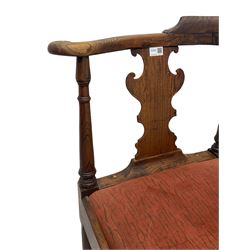18th century elm corner chair, the shaped arm rail supported by two splats with fret work scrolled ears, turned supports and cabriole front leg joined by turned stretchers, upholstered drop in seat 