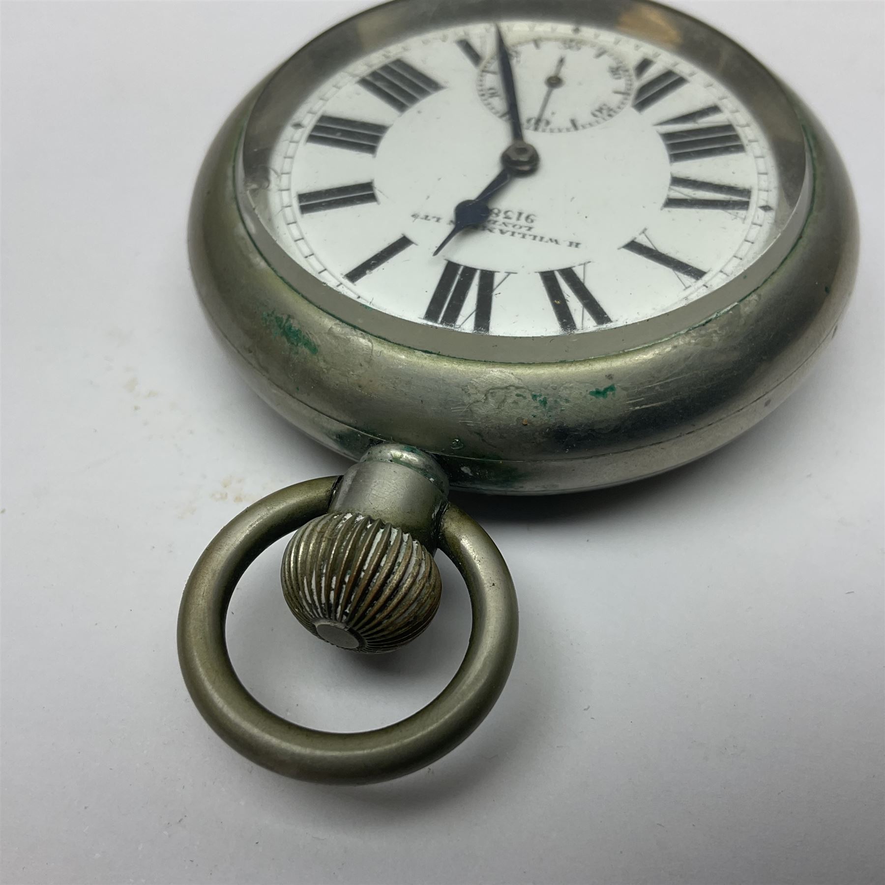 Early 20th century British Army officer's campaign clock in the form of a key-less wind nickel cased pocket watch with white dial, Roman numerals and subsidiary seconds dial, inscribed H. Williamson Ltd. London 9138F, the back with broad arrow and 9138F; in leather travelling case with dial aperture and brass easel support H14cm
