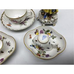Pair of Continental porcelain figures, modelled as a male and female figure with flowers, upon floral encrusted and C scroll bases, together with a pair of Continental cabinet cups and saucers, of quatrefoil form hand painted with flowers and butterflies, with printed marks beneath, and a German part fluted cup and saucer with similar decoration, in one box 