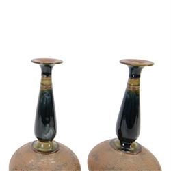 Pair of Royal Doulton vases by Christine Abbot, of squat circular form with elongated neck and flared rim, the body decorated with floral design, H26cm