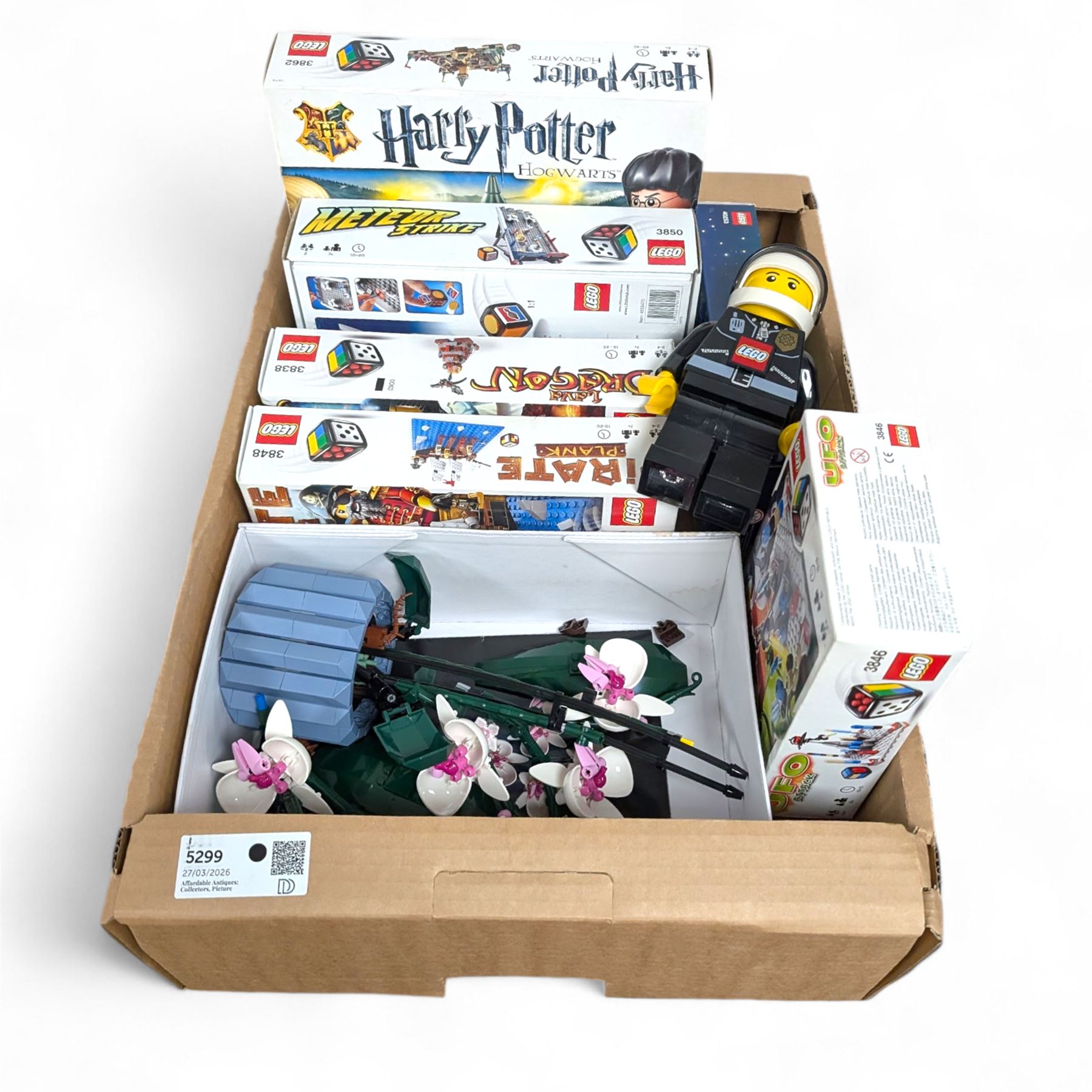 Lego, including partially built Lego Botanicals Orchid, minifigure torch light, five Lego Games including Harry Potter Hogwarts game, Lava Dragon, Pirate Plank, UFO Attack and Meteor Strike 