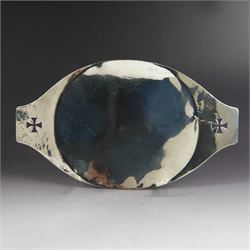 1920s silver paten, of oval form and handles with pierced cross decoration, engraved to un...