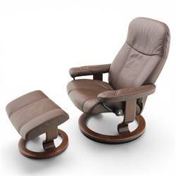Ekornes - Stressless medium brown leather recliner swiveling armchair and stool, brown leather recline with stitching, together with a matching stool, on a round base