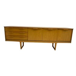 Stonehill Furniture (SF) Ltd - mid-20th century teak sideboard, rectangular topover three drawers, two cupboard doors and fall-front drinks cupboard, raised on square tapering supports