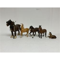 Group of Beswick figures of horses, to include a Palomino horse, Bay Shire horse, recumbent bay foal etc, all with printed marks beneath (5)