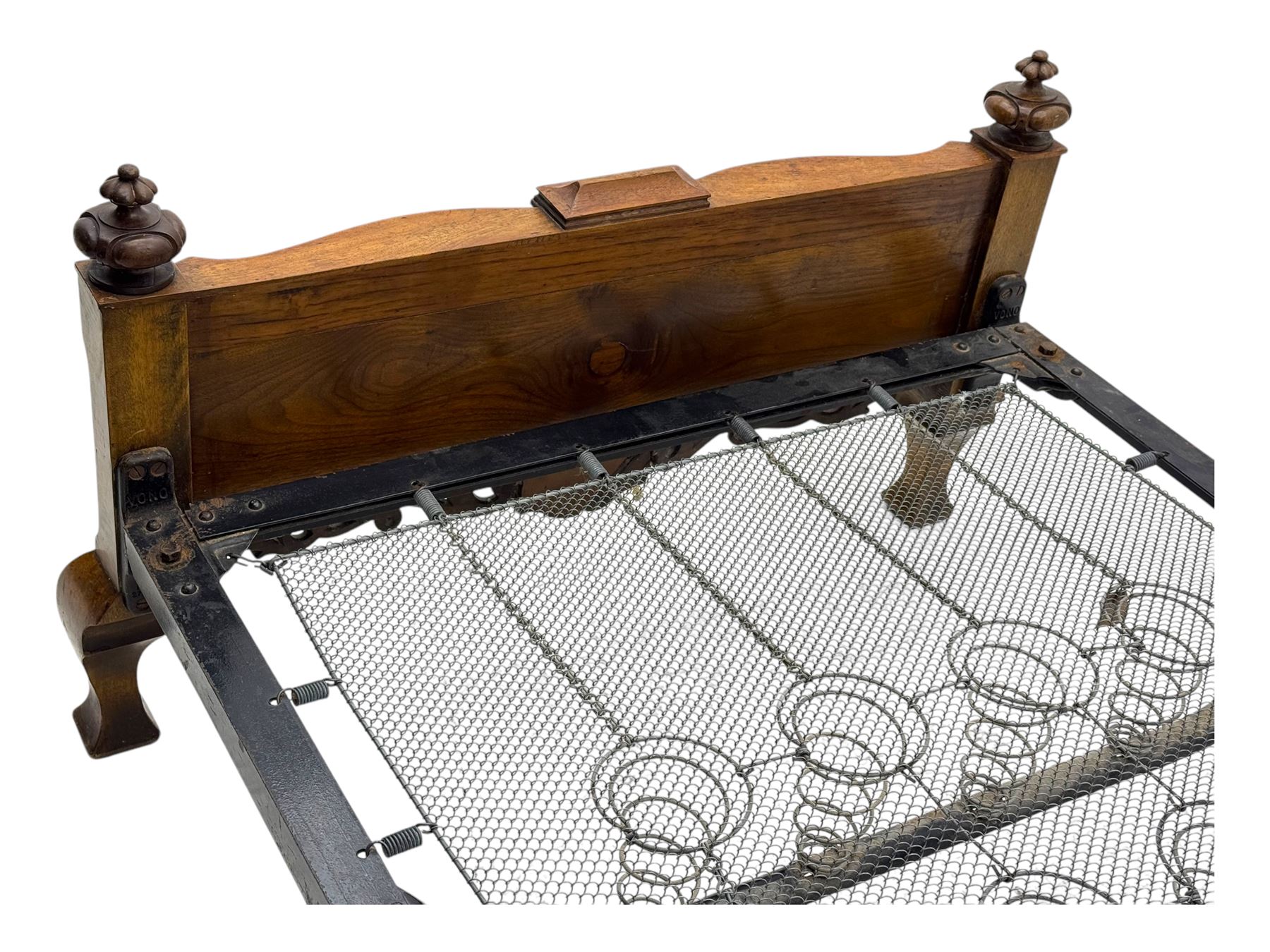 Mid-20th century walnut single bedstead, high shaped headboard, footboard with turned finials and scrollwork carvings, complete with 'Vono' iron frame, raised on cabriole supports