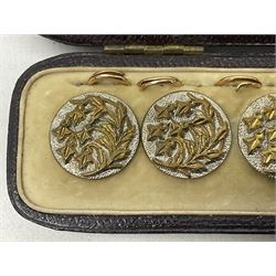Set of six early 20th century gilt buttons, with stylised foliate decoration, in silk leather and velvet case stamped 'Streeter & Co, New Bond Street, London' 