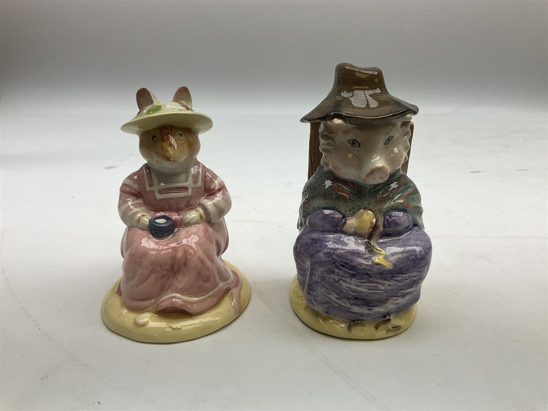 Two Royal Doulton Brambly Hedge figures comprising ‘Mrs Saltapple’ and ‘Poppy Eyebright’, Royal Albert Beatrix Potter ‘Foxy Whiskered Gentleman’ and ‘Mr Benjamin Bunny’, all with boxes, two Border Fine Arts Beatrix Potter figures comprising ‘Mrs Tiggywingle’ and ‘Mrs Rabbit’, Royal Doulton ‘Spike and Tyke’ and ‘Winnie Pooh and Footprints’ both with boxes, all marked beneath