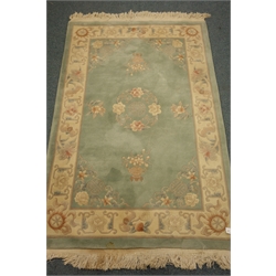  Turkish style rug, beige ground, (194cm x 144cm) and a chinese style rug, light green ground, (186cm x 122cm)  