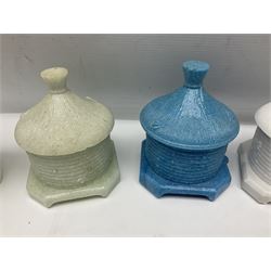 Collection of glass beehive honey pots, to include a blue slag example, milk glass, pink, green, etc together with four white metal examples (16) 