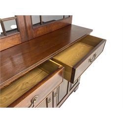 Acorn Industries - Georgian design mahogany bookcase on cupboard, fitted with two astragal glazed doors enclosing three glass shelves, base with two cock-beaded drawers over two panelled cupboards, inlaid with acorn signature, by Alan Grainger, Brandsby