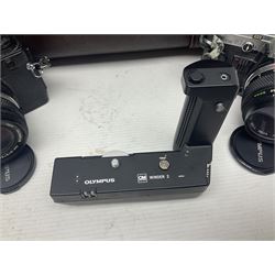 Olympus OM-2 camera body, serial no 1117526, with Olympus OM-System Zuiko Auto-W 28mm 1:2.8'  lens serial no 336591, Olympus OM10 camera body serial no 2392257, with Olympus OM-System Zuiko Auto-Macro 50mm 1:3.5' lens serial no 225784, Soligor C/D mirror lens 1:8 f=500mm' serial no 784035650 together with other camera equipment 