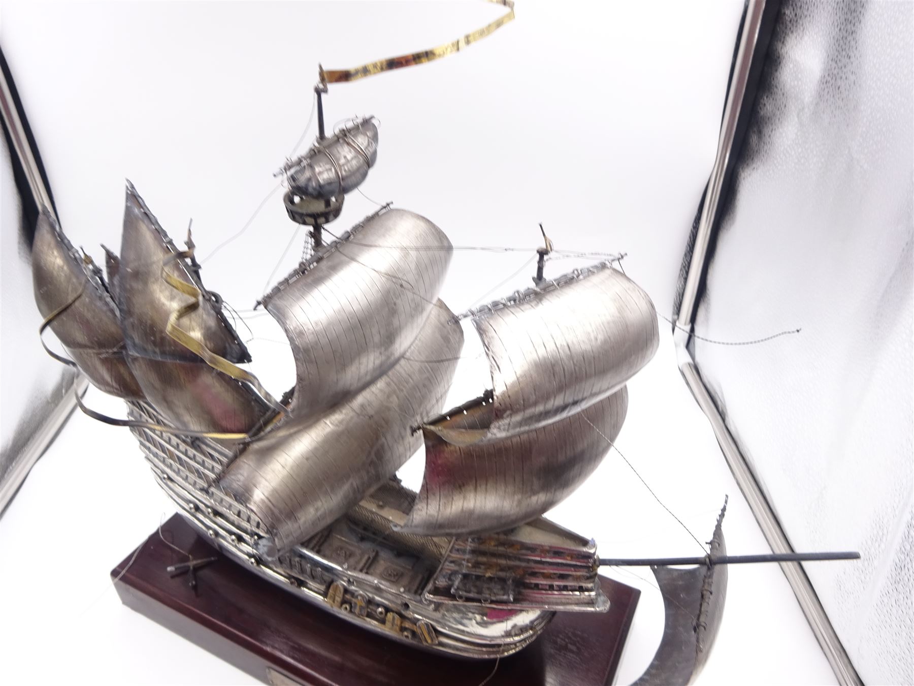 Modern silver limited edition model of The Mary Rose, depicting the ship in full sail, with gilded details, hallmarked Ammonite Ltd, Birmingham 1982, model height 32cm, mounted upon rectangular wooden plinth with applied silver name plaque, no. 9/250, overall H36.5cm