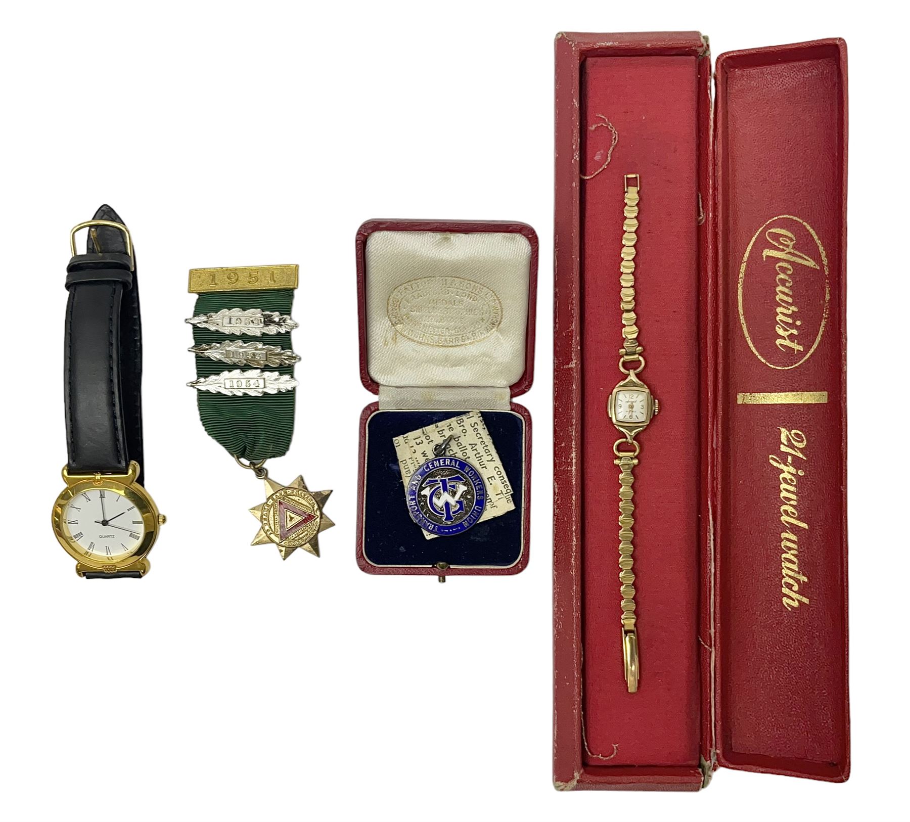 Ladies Accurist 9ct gold manual wind wristwatch, on gilt metal bracelet, together with a silver and enamel fob, for the Transport and General Workers Union, with personal engraving to reverse, hallmarked, a safe driving medal and a Quartz wristwatch