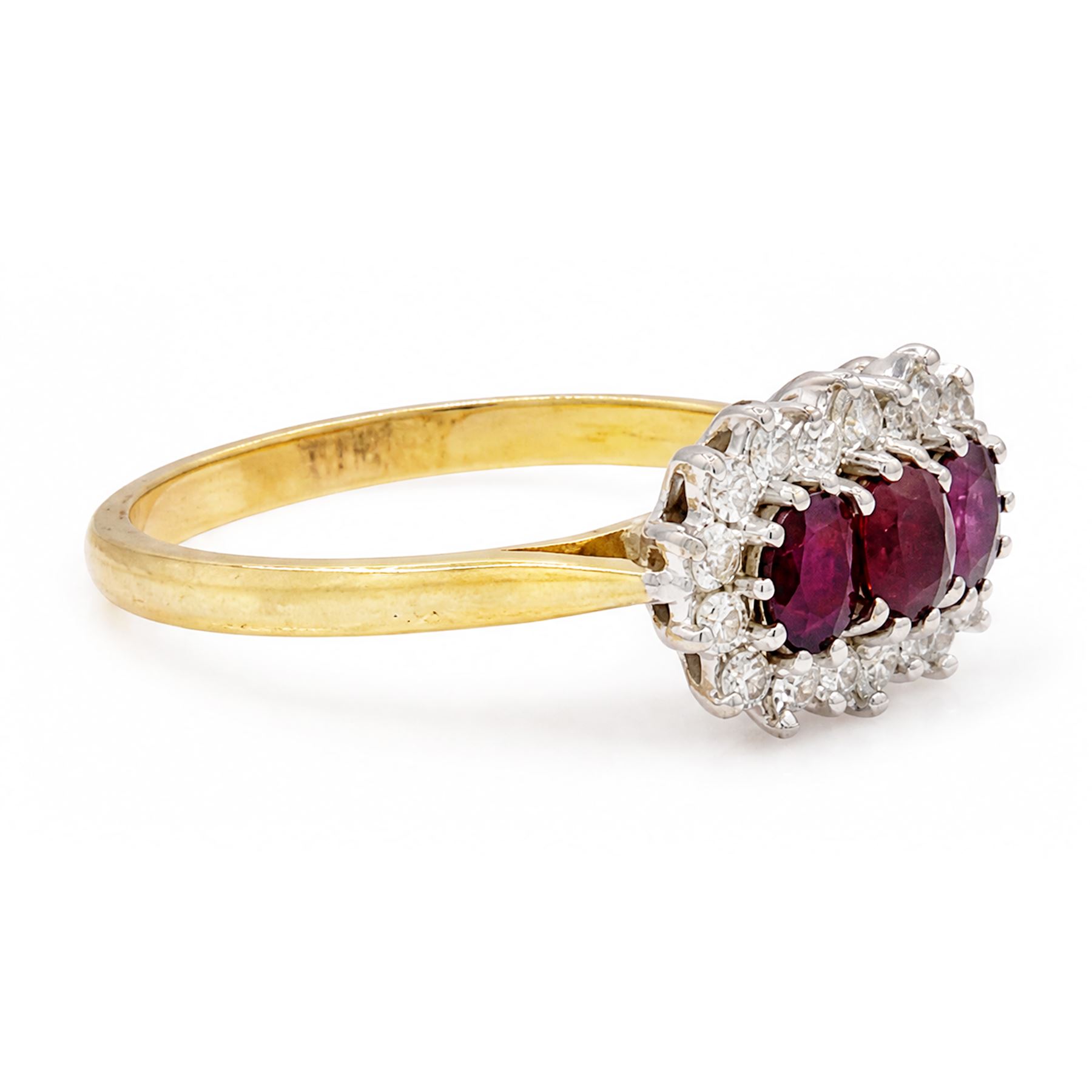 18ct gold ruby and diamond cluster ring, three oval cut rubies surrounded by eighteen single cut diamonds, London 1979, total ruby weight approx 0.55 carat, total diamond weight approx 0.20 carat