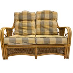 Two seat bamboo and cane conservatory sofa, and pair of matching armchairs with footstool and cane nest of tables 