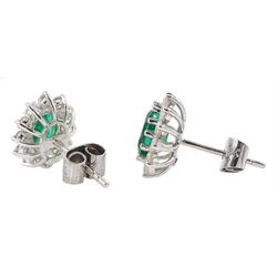 Pair of 18ct white gold oval emerald and diamond cluster stud earrings, total emerald weight approx 1.50 carat, total diamond weight approx 0.75 carat