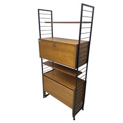 Staples Ladderax - mid-20th century teak and metal framed modular wall unit, fitted with central fall-front cupboard enclosing correspondence dividers, over secondary separate teak fall-front cupboard, adjustable shelf to top