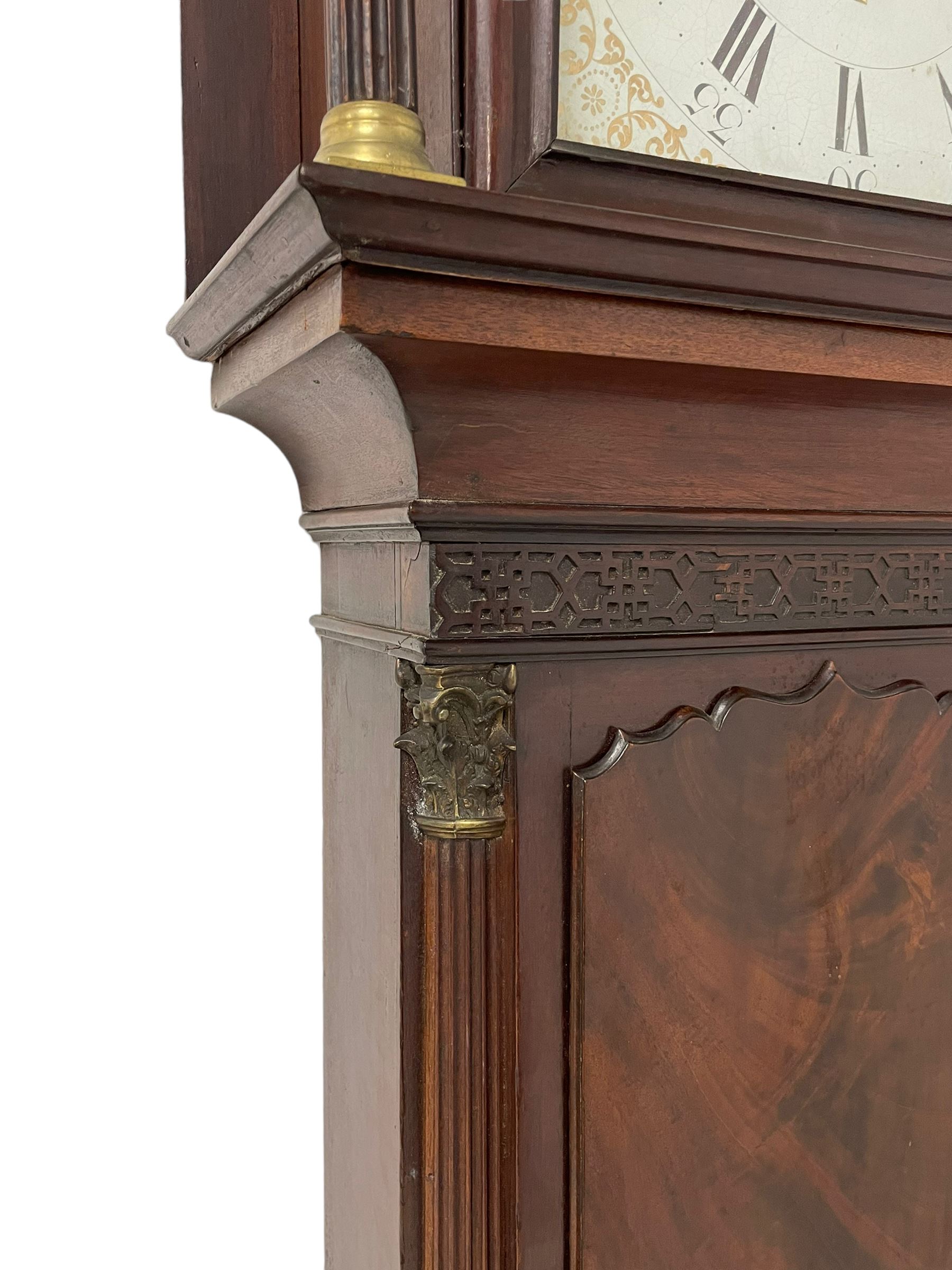 W. Phillips of Bromyard - 8-day mahogany longcase with a painted moon roller dial, c 1790,
swans neck pediment with dog tooth moulding, raised carving and  brass paterie, break arch hood door beneath flanked by reeded pilasters with brass Corinthian capitals, trunk with a blind fret, reeded quarter columns and long wavy topped door,
Plinth with a deep moulding and canted corners raised on a shaped base, painted dial with gesso spandrels, Roman numerals, five minute Arabic's and minute dots, with steel hands, seconds dial and square date aperture, dial pinned to a rack striking movement with an anchor escapement, striking the hours on a cast bell. A clockmaker by the name of John Phillips is recorded as working in Bromyard (Worcs)  in the early to mid 18th century, certainly by 1770-90. W. Phillips was possibly an unrecorded son or brother also working in the same family clockmaking business during the later part of the 18th century.
