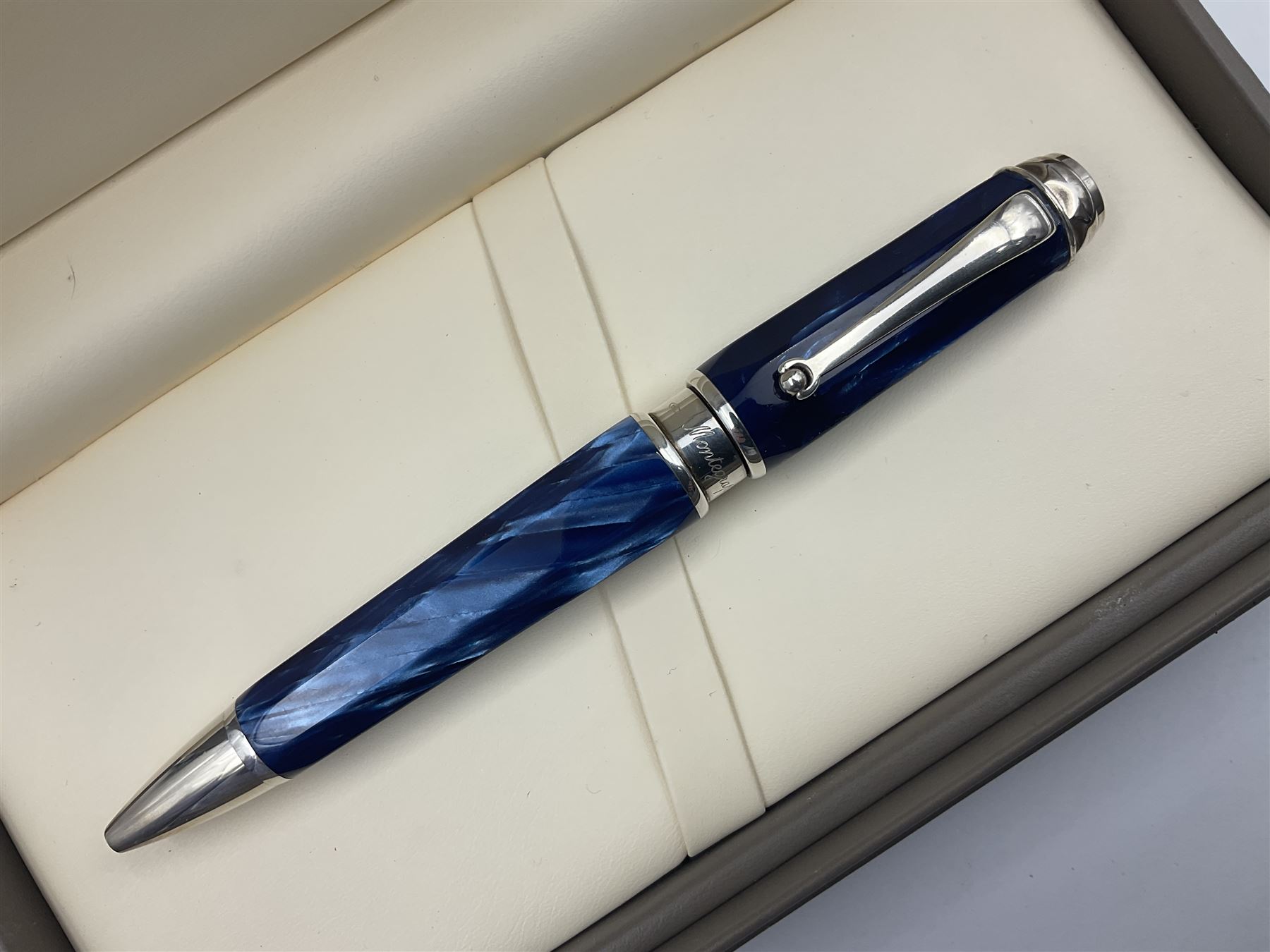 Montegrappa Emblema ball pen, the blue pearl marbled barrel of octagonal form with silver mounts and terminal with 1912 emblem, stamped 925 and clip with roller, in box, L13.5cm