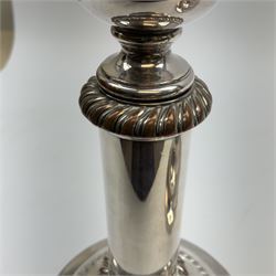 A pair of silver plated telescopic candlesticks, with gadrooned detail and spreading circular feet, not extended H21.5cm extended H28cm.