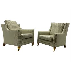 Three-piece hardwood-framed lounge suite - large two-seat Knole sofa with drop ends, upholstered in patterned fabric decorated with urns and foliage (W190cm, D117cm, H88cm); armchair upholstered in contrasting geometric pattern fabric (W83cm, D102cm, H93cm); and another armchair (W82cm, D102cm, H92cm) (3)