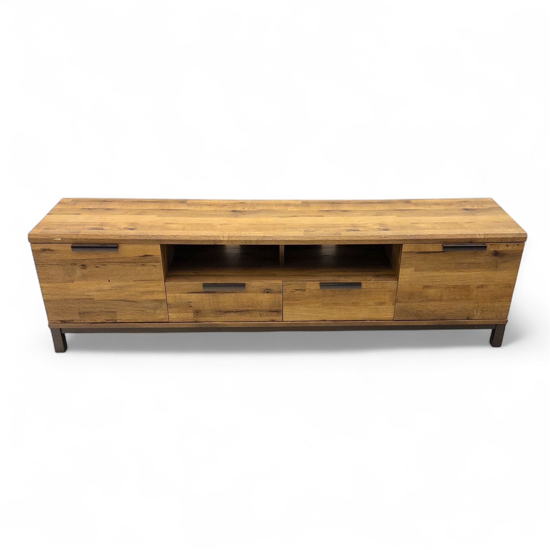 Pair of contemporary media sideboards, oak effect construction with inset handles, comprising two drawers and an open shelf flanked by cupboard doors, on metal supports (2)