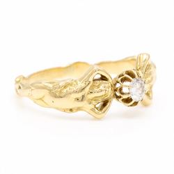 Gold diamond figural ring, single old cut diamond of approx 0.45 carat, with a nude female figure either side, stamped 18ct
