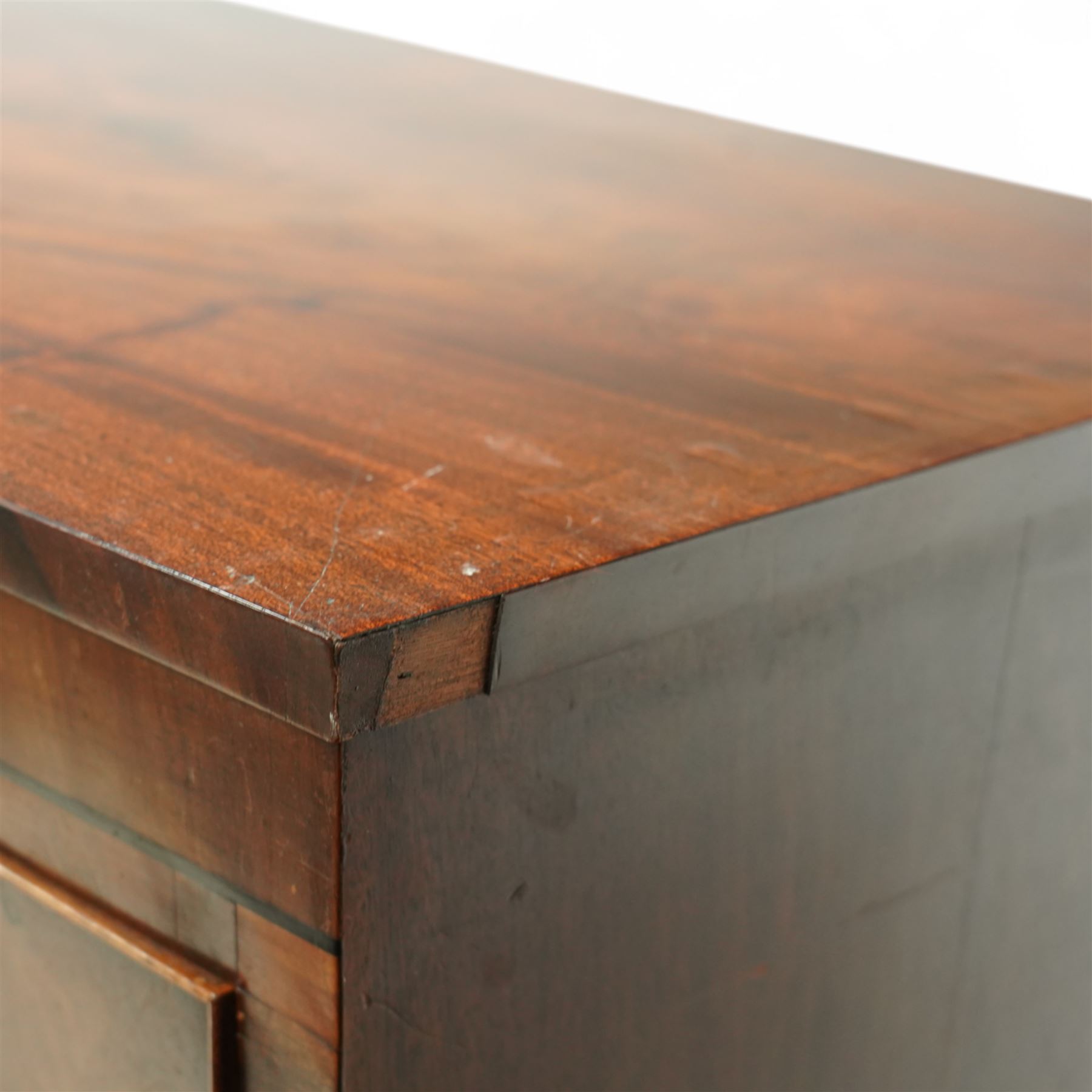 19th century mahogany chest of drawers, bow fronted form with two short over three long drawers, each veneered in matched flame mahogany, on turned feet